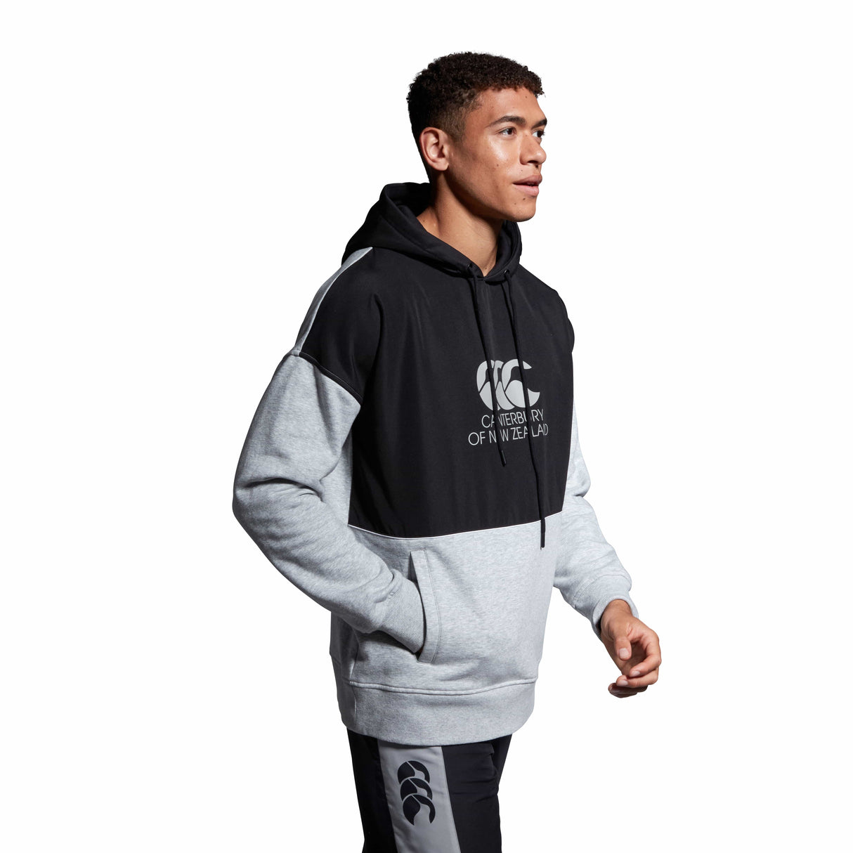 A man wearing a Canterbury Legends Panel Hoody.