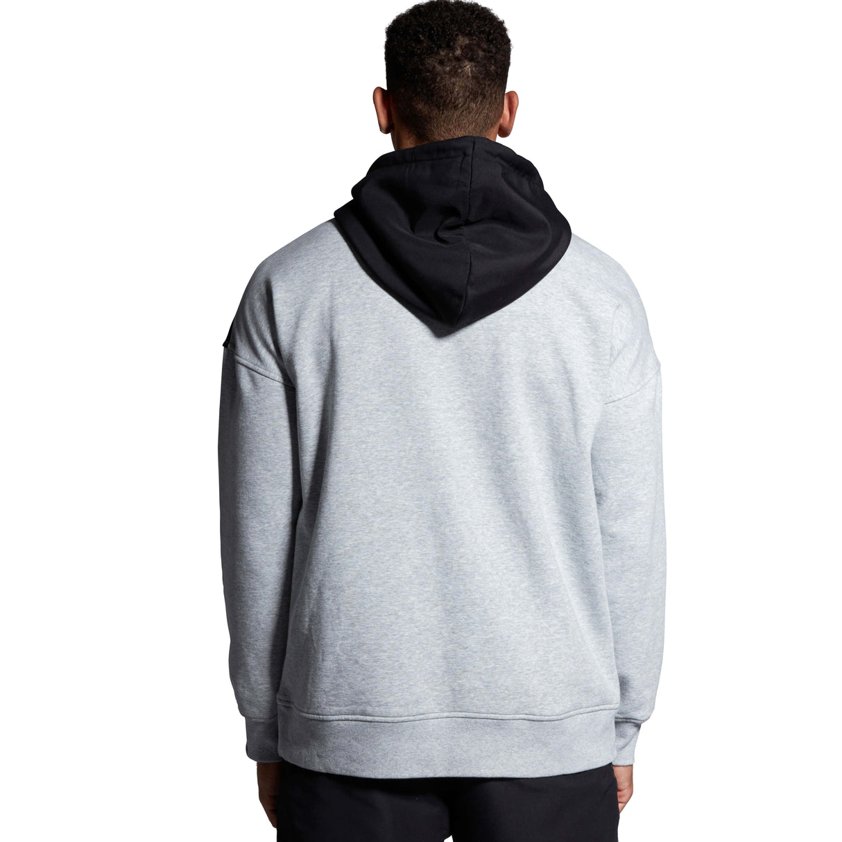 The back view of a man wearing a Canterbury Legends Panel Hoody by Canterbury, in grey and black. Coming soon.