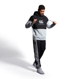 A man in a Canterbury Legends Panel Hoody by Canterbury.