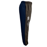 Introducing the Canterbury Harlequin Block Stadium Trackpant, a stylish pair of navy and grey sports pants featuring an elastic waistband and the iconic CCC logo on the side.