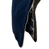 Close-up view of the side of a blue sleeping bag with a partially open zipper revealing a patterned lining inside, reminiscent of the vibrant design found in the Canterbury Harlequin Block Stadium Trackpant.