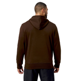 A man in a Canterbury Uglies Hoodie with bold block colors and black pants is seen from behind, glancing to his right against a white backdrop.