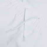 Close-up of the white elastic waistband with an adjustable drawstring, featured on our Canterbury Player's Drill Short by Canterbury.