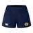 The Old Man Rivah Rugby Women's Advantage Short 2.0 by EMB Canterbury features navy blue fabric, a white Canterbury logo on the left leg, and a gold and white crest on the right, designed for both performance and style.