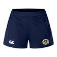 The Old Man Rivah Rugby Women's Advantage Short 2.0 by EMB Canterbury features navy blue fabric, a white Canterbury logo on the left leg, and a gold and white crest on the right, designed for both performance and style.