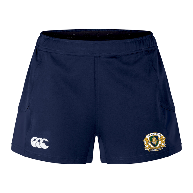 The Old Man Rivah Rugby Women's Advantage Short 2.0 by EMB Canterbury features navy blue fabric, a white Canterbury logo on the left leg, and a gold and white crest on the right, designed for both performance and style.
