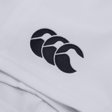Close-up of the white Professional Short 2.0 by Canterbury, featuring a black embroidered logo with three overlapping Cs. Enhanced durability ensures lasting performance.