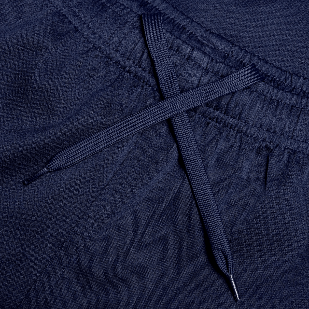Close-up of the navy blue elastic waistband with a matching drawstring in an X shape, showcasing the adjustable fit and durability of the Canterbury Professional Short 2.0.