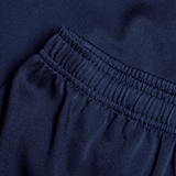 Close-up of navy blue fabric reveals an elastic waistband and gathered stitching, highlighting the durability of the Canterbury Professional Short 2.0.