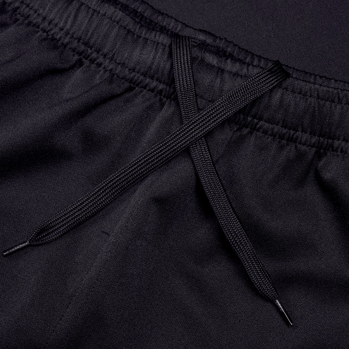 Close-up of the Canterbury Professional Short 2.0, featuring a black elastic waistband and X-tied drawstring for an adjustable, durable fit.