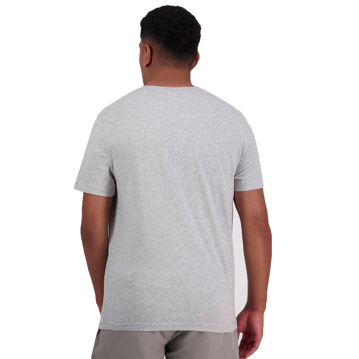 A person is seen from the back wearing a light gray, comfortable fit short-sleeve Canterbury of New Zealand Logo T-Shirt by Canterbury and gray shorts.