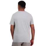A person is seen from the back wearing a light gray, comfortable fit short-sleeve Canterbury of New Zealand Logo T-Shirt by Canterbury and gray shorts.