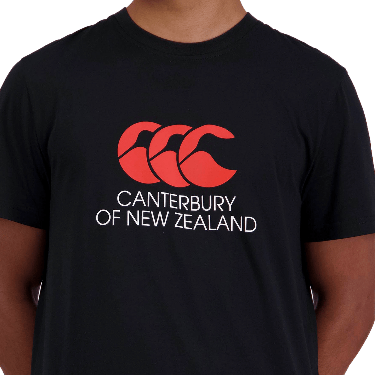 Person wearing a black Canterbury of New Zealand Logo T-Shirt by Canterbury with the red "CCC" logo and "Canterbury of New Zealand" text.