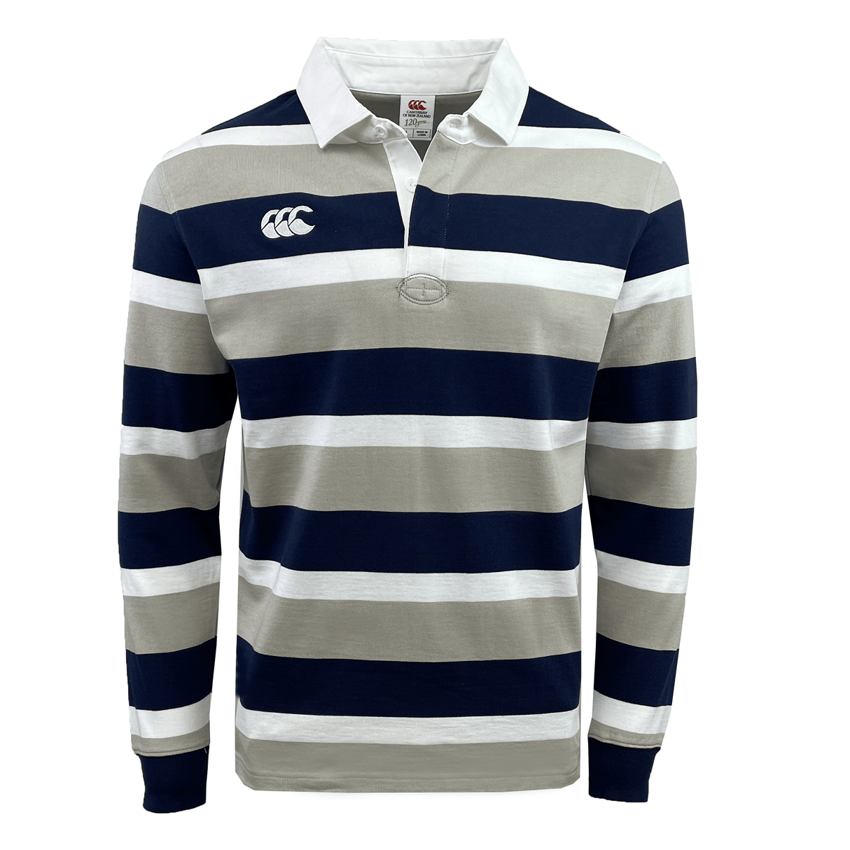 The Canterbury CCC Stripe Long Sleeve Rugger is a stylish rugby shirt featuring thick horizontal stripes in navy blue, beige, and white. It is designed with a white collar and includes a small logo on the left chest area.