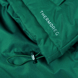 Close-up of an Ireland 24 Puffer Jacket by Canterbury in green, with the word "THERMOREG" printed on it, featuring a drawstring with a black plastic toggle.