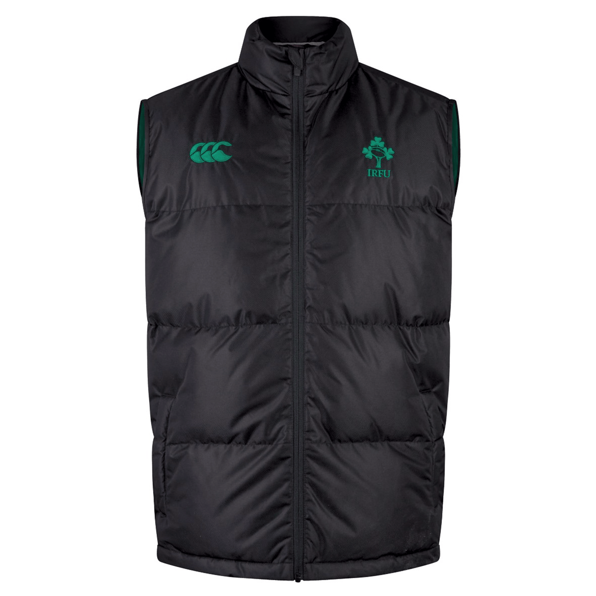 The Ireland 24 Padded Gilet by Canterbury is a sleeveless black puffer vest with Thermoreg insulation, featuring a zip front and adorned with green emblems and logos on the chest.