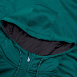 Close-up of a Canterbury Ireland Training Hoodie 24 in teal fabric with a drawstring hood. The interior of the hood is lined with dark fabric, highlighting the texture and color detail of the 100% polyester material.