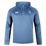 The Ireland Training Hoodie 24 by Canterbury is a blue hoodie featuring a white clover emblem and the text "IRFU" on the left chest, complemented by a white logo on the right chest. This durable polyester hoodie is crafted by Canterbury.