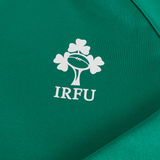 Close-up of the Ireland 25/26 Training Hoodie by Canterbury, a green rugby hoodie with the white IRFU logo featuring a rugby ball and shamrocks.