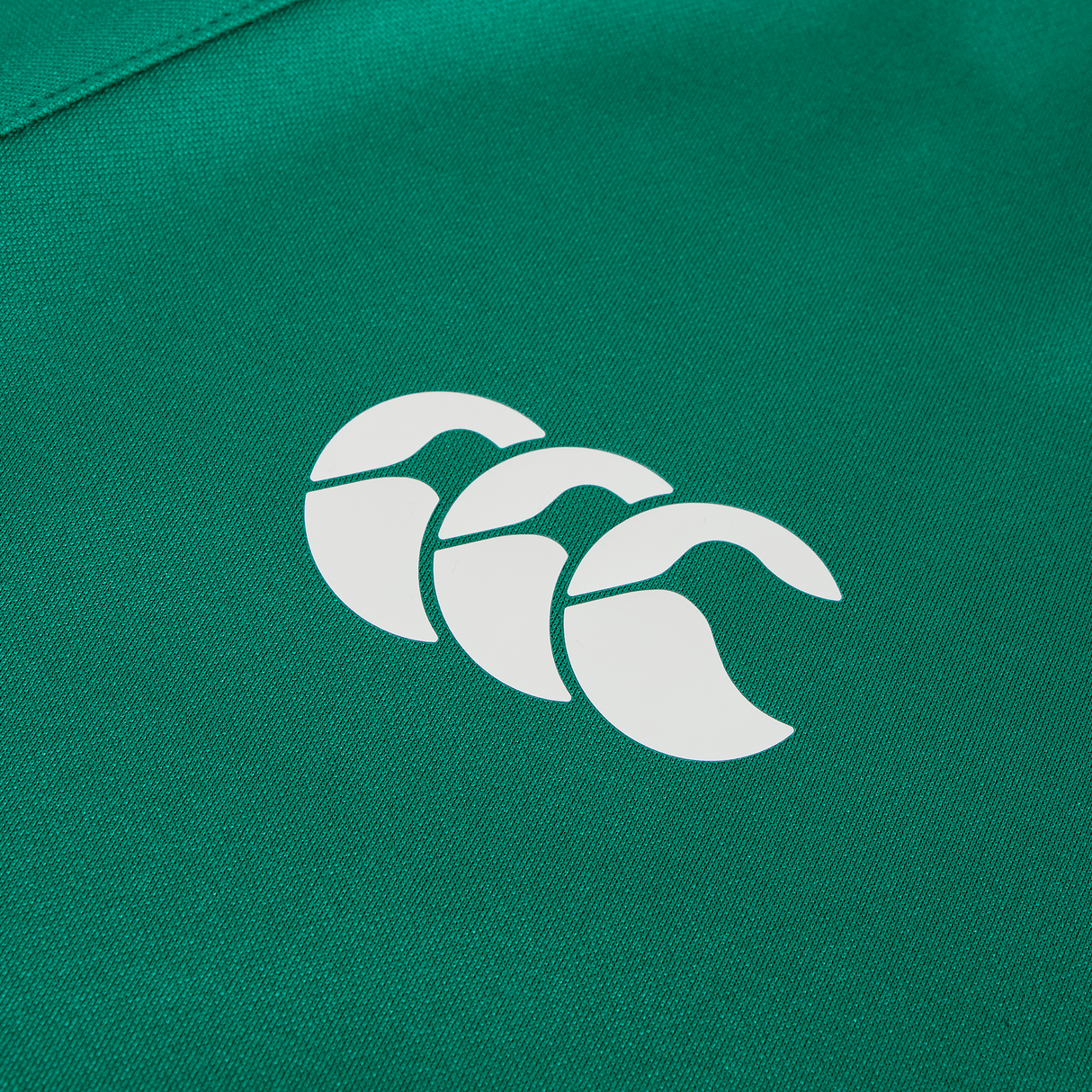 The Ireland 25/26 Training Hoodie by Canterbury features a white triple curved logo on green fabric—ideal for fans seeking comfort and style.