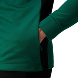 Someone wears the Ireland 25/26 Training Hoodie by Canterbury, featuring the IRFU crest, with their right hand tucked into a side pocket.