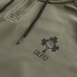 Close-up of the Ireland 25/26 Training Hoodie by Canterbury in khaki, showcasing black drawstrings and the IRFU shamrock and rugby ball logo printed on the fabric.