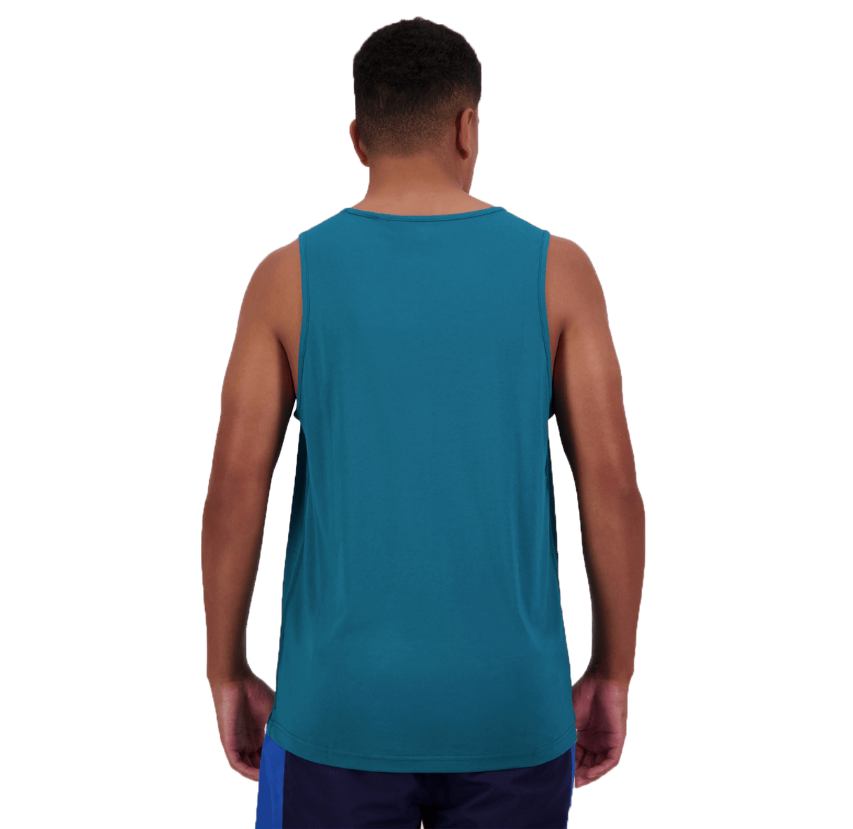 A person wearing a Canterbury Radial CCC Logo Singlet in teal and blue shorts is standing with their back to the camera, exemplifying a fashionable combination of workout attire.
