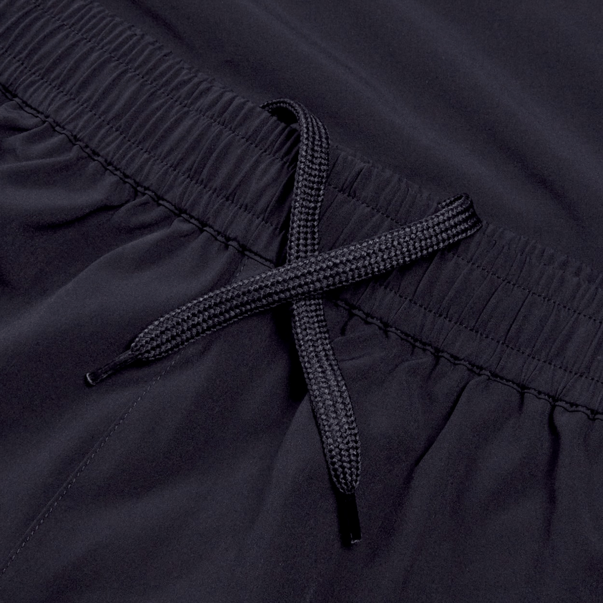 Close-up of the black elastic waistband on the Ireland 24 Woven Gym Short by Canterbury, featuring an intertwined black drawstring.