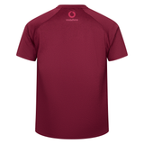 The Ireland 25/26 Autumn Internationals Elite Training Tee by Canterbury is a maroon short-sleeve sports shirt with Vapodri technology and a small Vodafone logo near the collar, shown from the back.