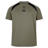 The Ireland 25/26 Autumn Internationals Elite Training Tee by Canterbury features olive green fabric, black shoulder accents, and IRFU and Canterbury chest logos. Made with Vapodri tech, it’s shown on a plain white background.