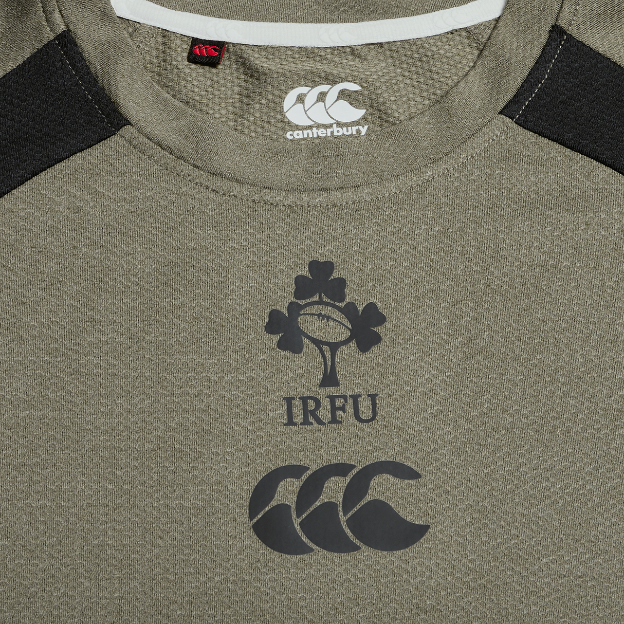 Close-up of the Ireland 25/26 Autumn Internationals Elite Training Tee by Canterbury, showcasing the IRFU logo and advanced Vapodri technology for comfort on the chest.