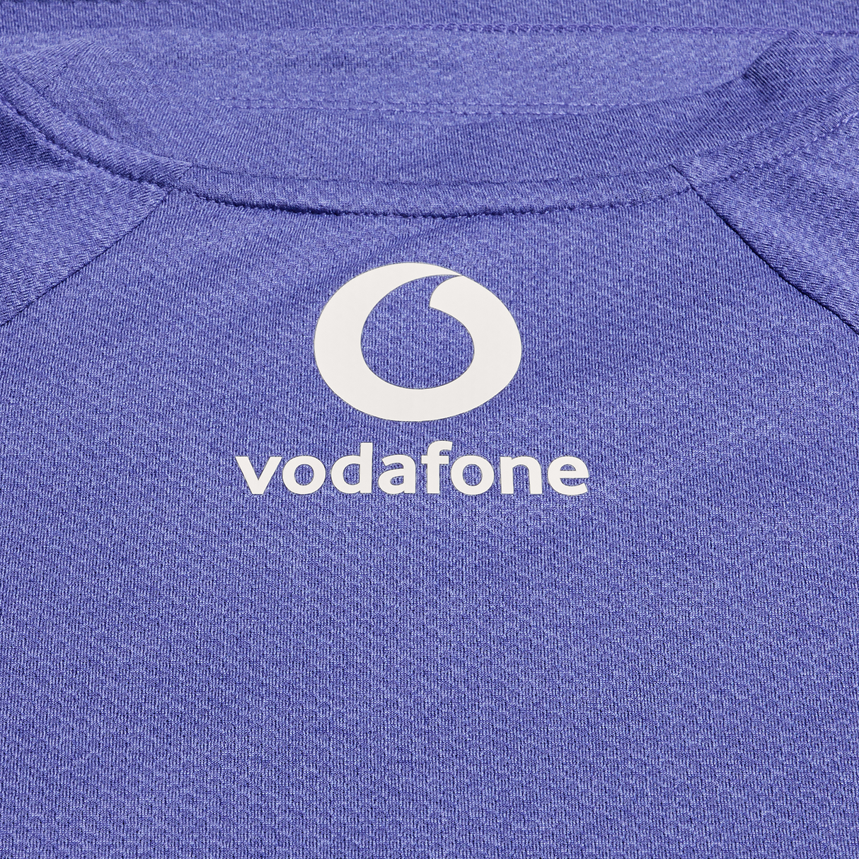 Close-up of the Ireland 25/26 Six Nations Elite Training Tee by Canterbury, featuring the Vodafone logo and Canterbury branding in white on the chest—an essential rugby training shirt.