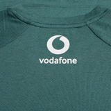 Close-up of the Ireland 25/26 Six Nations Elite Training Tee by Canterbury in green, featuring the white Vodafone logo and text on the upper back.