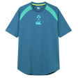The Ireland 26/27 Summer Tour Elite Training Tee by Canterbury features blue short sleeves with light green shoulder panels, IRFU and Canterbury chest logos, delivering top comfort and performance for rugby fans.
