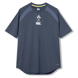 The Ireland 26 Elite Training Tee by Canterbury is a short-sleeve navy blue athletic shirt featuring IRFU and Canterbury logos on the chest, designed specifically as an Ireland rugby training tee and crafted from Vapodri breathable sportswear fabric, shown against a plain white background.