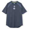 The Ireland 26 Elite Training Tee by Canterbury is a short-sleeve navy blue athletic shirt featuring IRFU and Canterbury logos on the chest, designed specifically as an Ireland rugby training tee and crafted from Vapodri breathable sportswear fabric, shown against a plain white background.