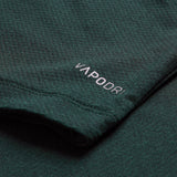 Close-up of a dark green fabric from the Ireland 26 Elite Training Tee by Canterbury, featuring the word “VAPODRI” printed in white near the edge—a signature of Canterbury’s breathable sportswear technology.