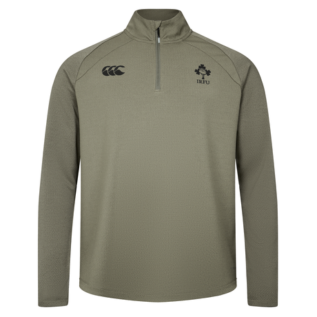The Ireland 25/26 Elite First Layer 1/4 Zip by Canterbury features long sleeves and IRFU and Canterbury logos on the chest, shown in light olive on a plain white background.