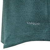 Close-up of green textured fabric from the Ireland 25/26 Elite First Layer 1/4 Zip by Canterbury, featuring "VAPODRI" embroidered in white—a signature Canterbury detail on this top.