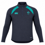 The Ireland 26/27 Summer Tour Elite First Layer by Canterbury is a dark navy quarter-zip athletic top with teal accents, Vapodri tech for comfort, and IRFU and Canterbury logos—crafted for Ireland’s elite summer tour squad.