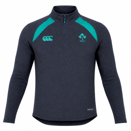 The Ireland 26/27 Summer Tour Elite First Layer by Canterbury is a dark navy quarter-zip athletic top with teal accents, Vapodri tech for comfort, and IRFU and Canterbury logos—crafted for Ireland’s elite summer tour squad.