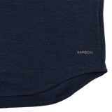 Close-up of the Ireland 26/27 Summer Tour Elite First Layer by Canterbury in navy blue textured fabric featuring Vapodri technology, with "VAPODRI" printed near the hem—a must-have for elite performance.