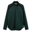 The Ireland 26 Elite First Layer by Canterbury is a dark green, long-sleeve quarter-zip pullover featuring black shoulder accents and chest logos. Crafted from Vapodri fabric for superior moisture management, this top is part of the Canterbury Elite collection and is shown here on a white background.