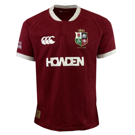 The British & Irish Lions 2025 Players Authentic Jersey by Canterbury is a striking red rugby jersey with white trim, featuring the British & Irish Lions emblem and "Howden" branding. Distinctive logos adorn the chest and sleeves, making it a must-have from Canterbury's collection.