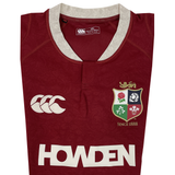 The British & Irish Lions 2025 Players Authentic Jersey by Canterbury showcases a red design with a white collar, Lions emblem, and Canterbury logo alongside "HOWDEN" text. It features intricate patterns and "Since 1888" text, honoring its legacy—ideal for the 2025 tour.