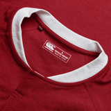 Close-up of a red British & Irish Lions 2025 Players Jersey by Canterbury sports shirt, featuring a white collar and clearly visible label. It emphasizes the moisture-wicking fabric crafted in China from recycled materials, offering optimal comfort and style both on and off the field.