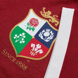 Close-up of the British & Irish Lions 2025 Players Jersey by Canterbury, showcasing the logo with four emblems: a red rose, shamrock, thistle, and feathers beneath a golden lion. The text "SINCE 1888" is visible on this moisture-wicking fabric.