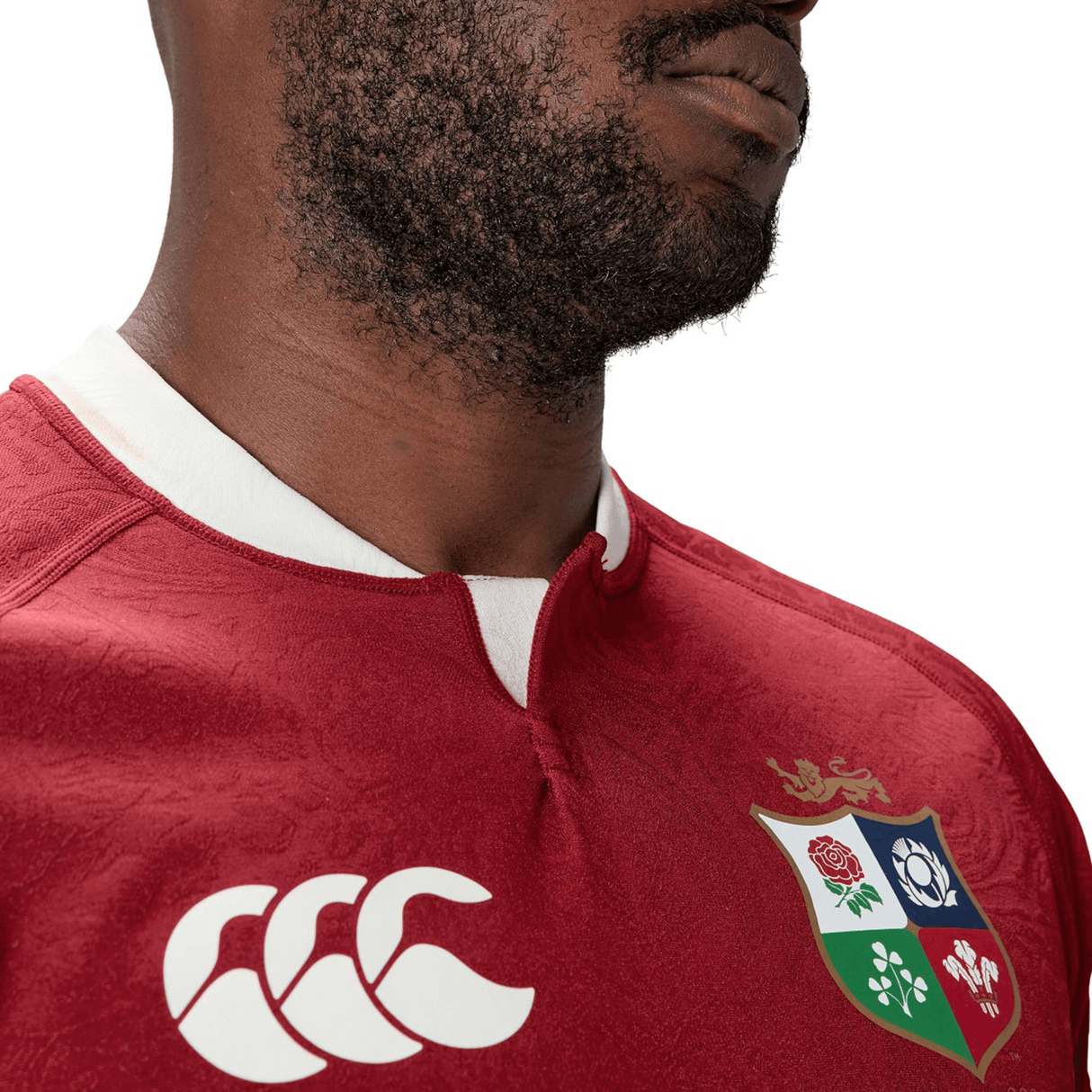 Someone wearing the British & Irish Lions 2025 Players Jersey by Canterbury, characterized by its white collar and multi-emblem logo, enjoys the advantage of moisture-wicking fabric for exceptional comfort.