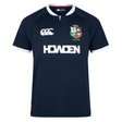 British & Irish Lions 2025 Training Jersey by Canterbury in navy blue, featuring a white collar and trim, the British & Irish Lions logo, anatomically positioned panels, Canterbury branding, and the "HOWDEN" text on the front.