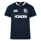 British & Irish Lions 2025 Training Jersey by Canterbury in navy blue, featuring a white collar and trim, the British & Irish Lions logo, anatomically positioned panels, Canterbury branding, and the "HOWDEN" text on the front.